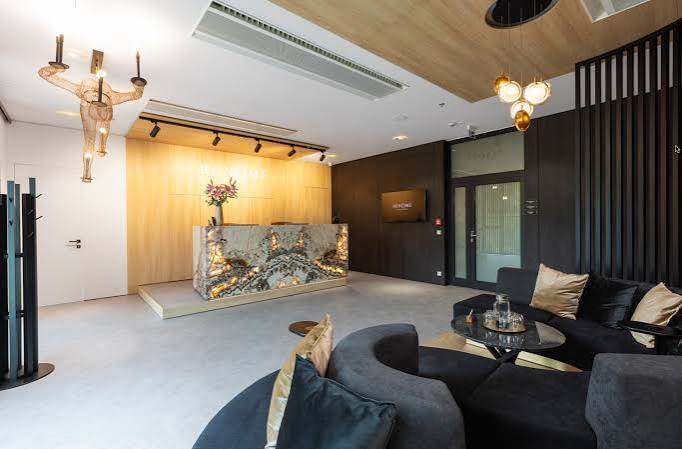 Wood-panelled reception with seating